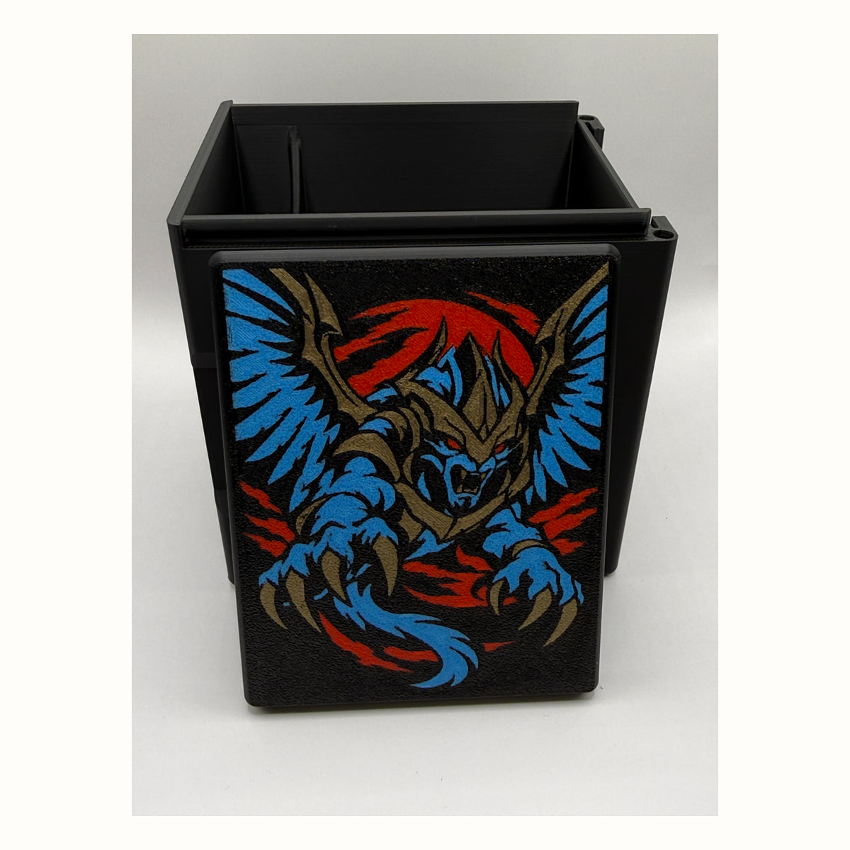 The Ur-Sphinx: The Ur-Sphinx printed lid artwork displayed in front of the open black box