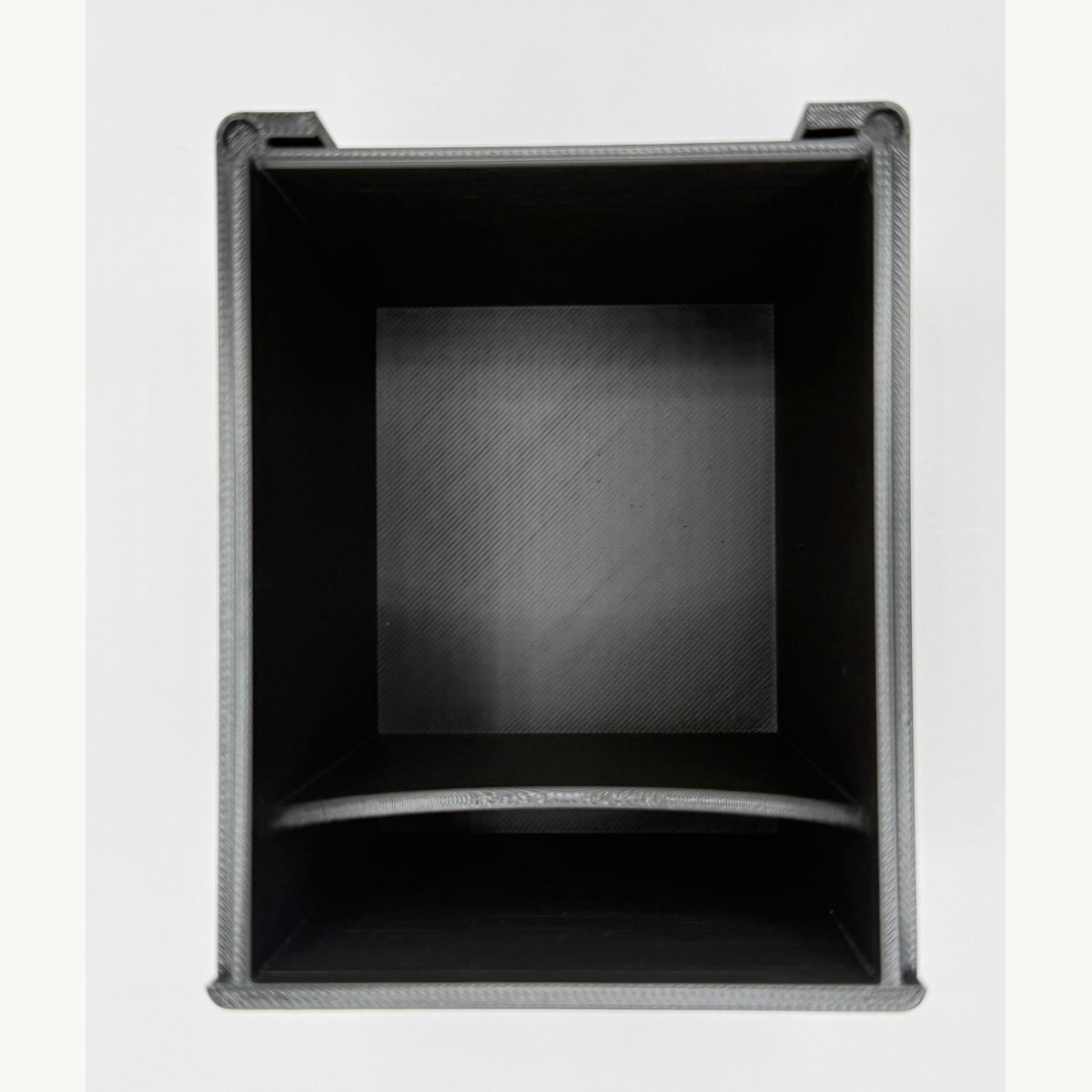 Black printed deck box interior viewed from above