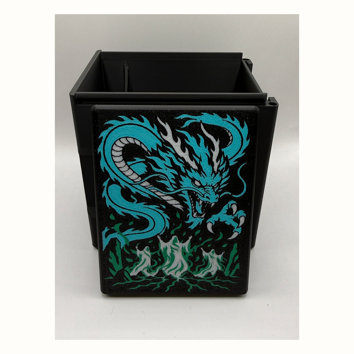 Teval / Dragon: Teval / Dragon printed lid artwork displayed in front of the open black box